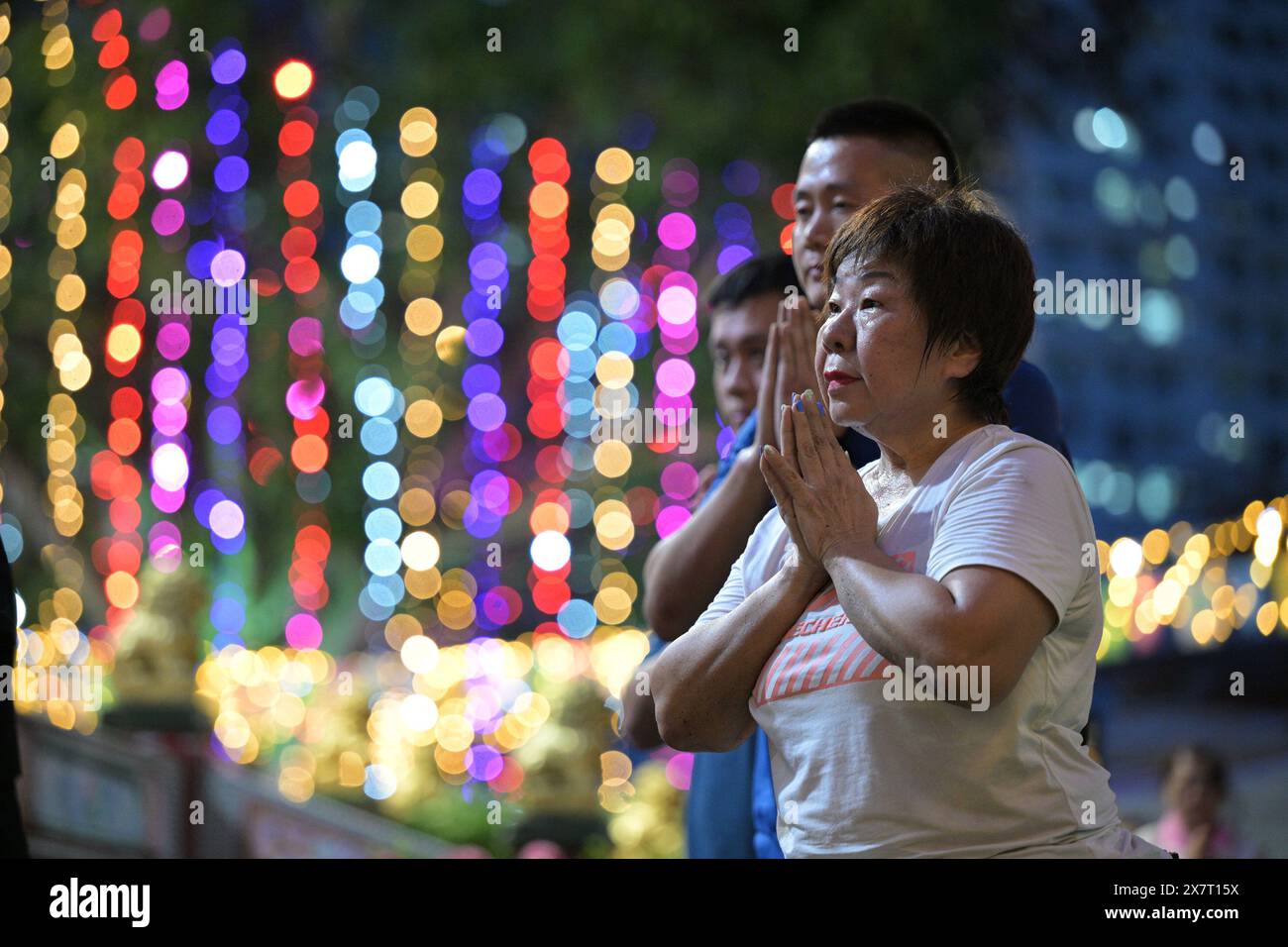 Singapore. 21st May, 2024. Buddhists pray on the eve of Vesak Day at Kong Meng San Phor Kark See Monastery in Singapore, May 21, 2024. Credit: Then Chih Wey/Xinhua/Alamy Live News Stock Photo