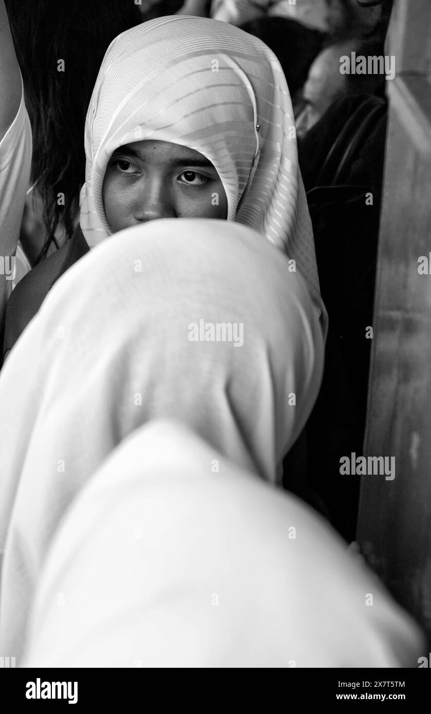 Thailand, Bangkok, a muslim girl standing on a crowded ferryboat Stock Photo