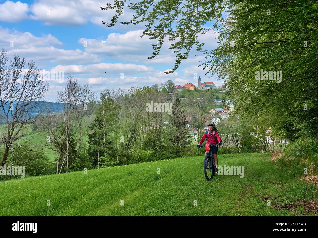 active senior woman on a bike packing tour with her electric mountain ...