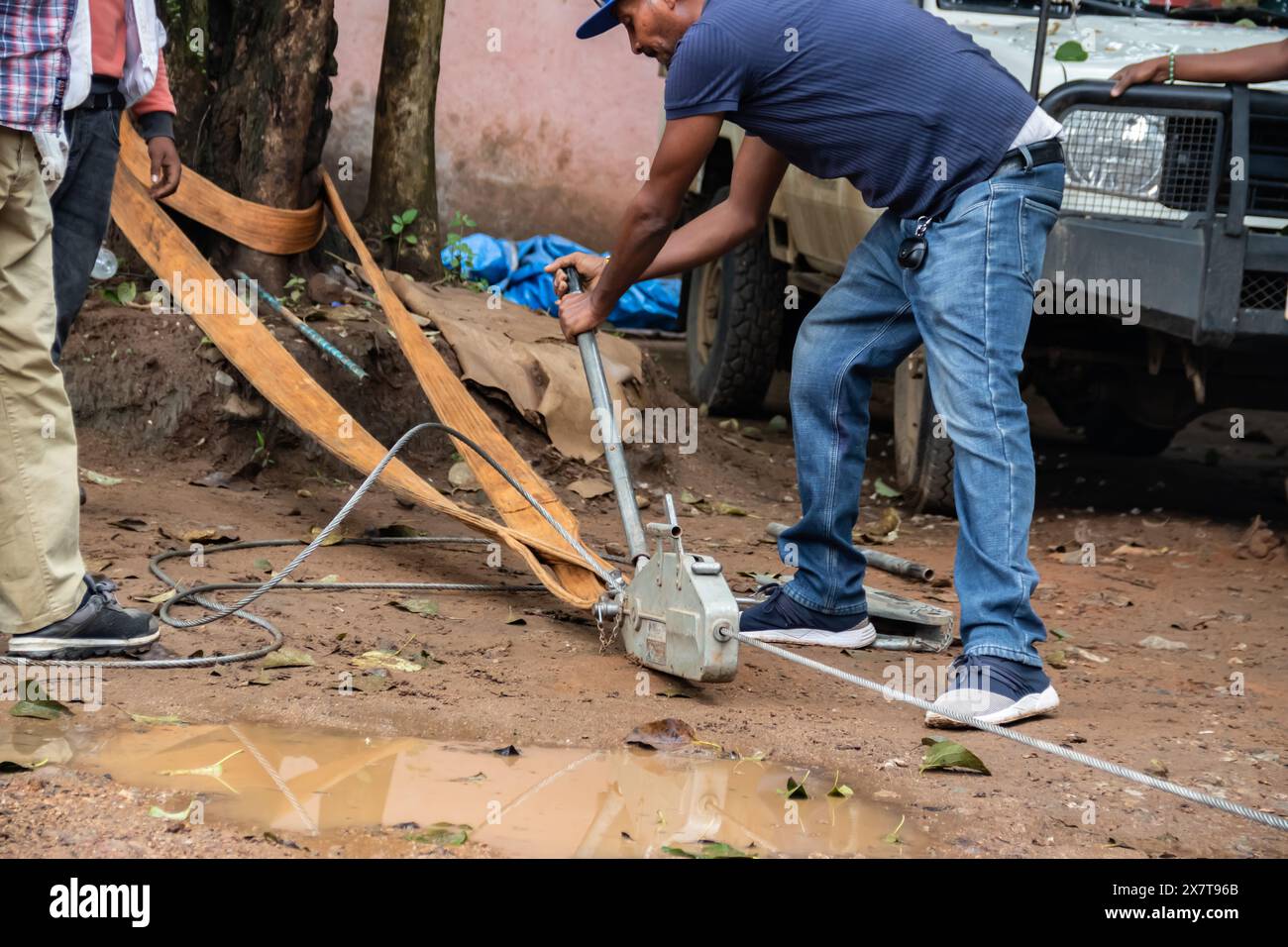 Recovery equipment for unstacking 4x4 vehicle out of muddy road, sand plates, mechanical winch, ropes, high lift jack, shovel, safety equiopment Stock Photo