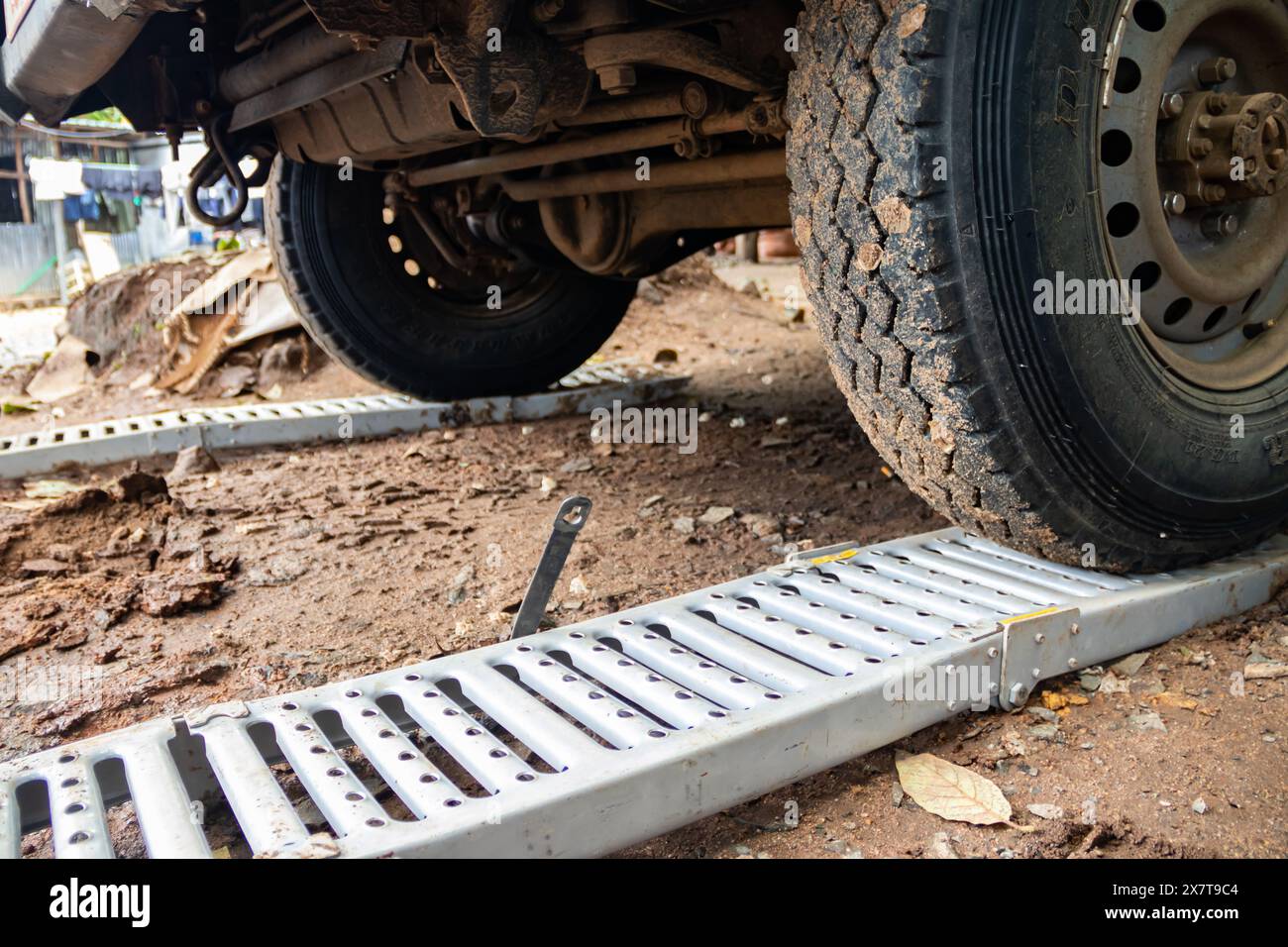 Recovery equipment for unstacking 4x4 vehicle out of muddy road, sand plates, mechanical winch, pooling ropes, high lift jack, shovel Stock Photo