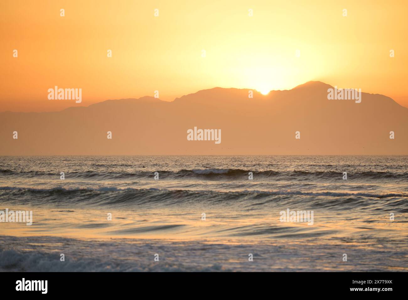 Sun rising over sandy beach hi-res stock photography and images - Alamy