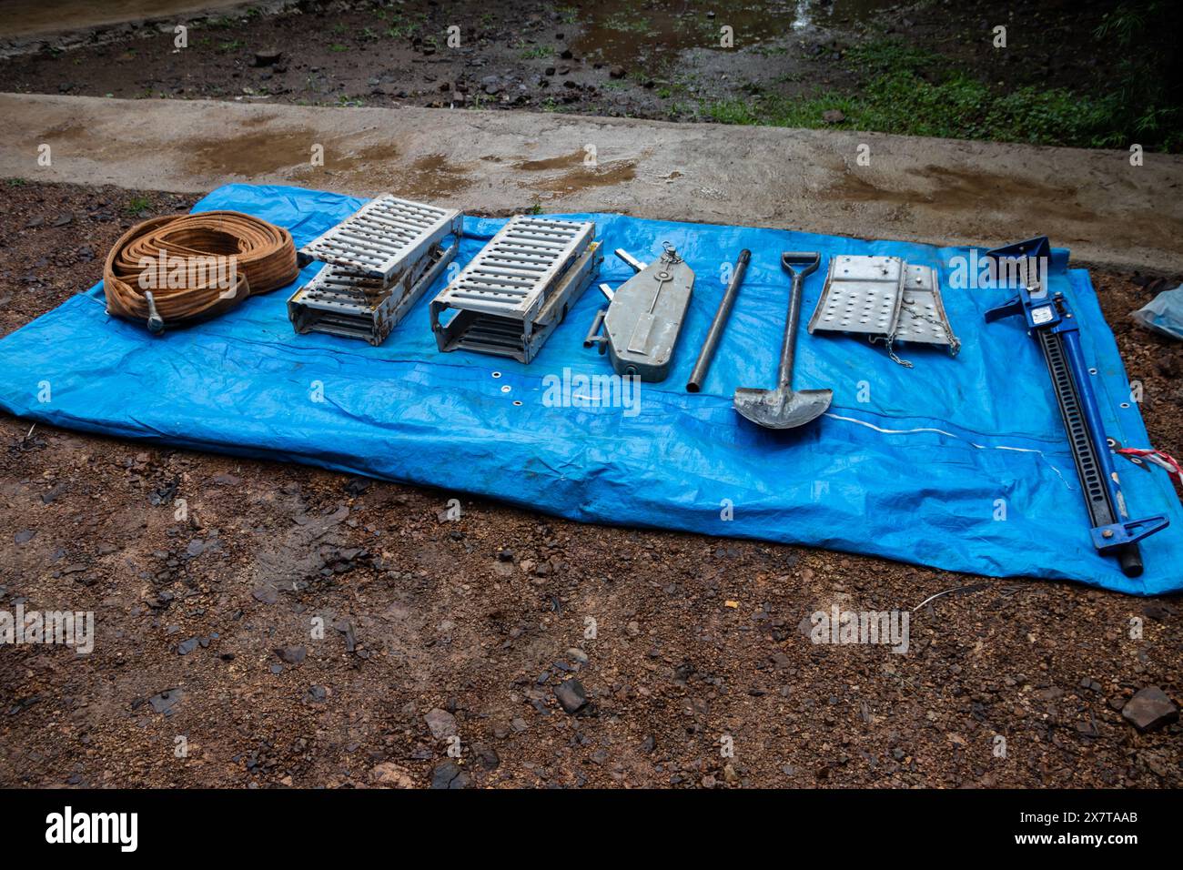 Recovery equipment for unstacking 4x4 vehicle out of muddy road ready to use, sand plates, mechanical winch, pooling ropes, high lift jack, shovel. Stock Photo