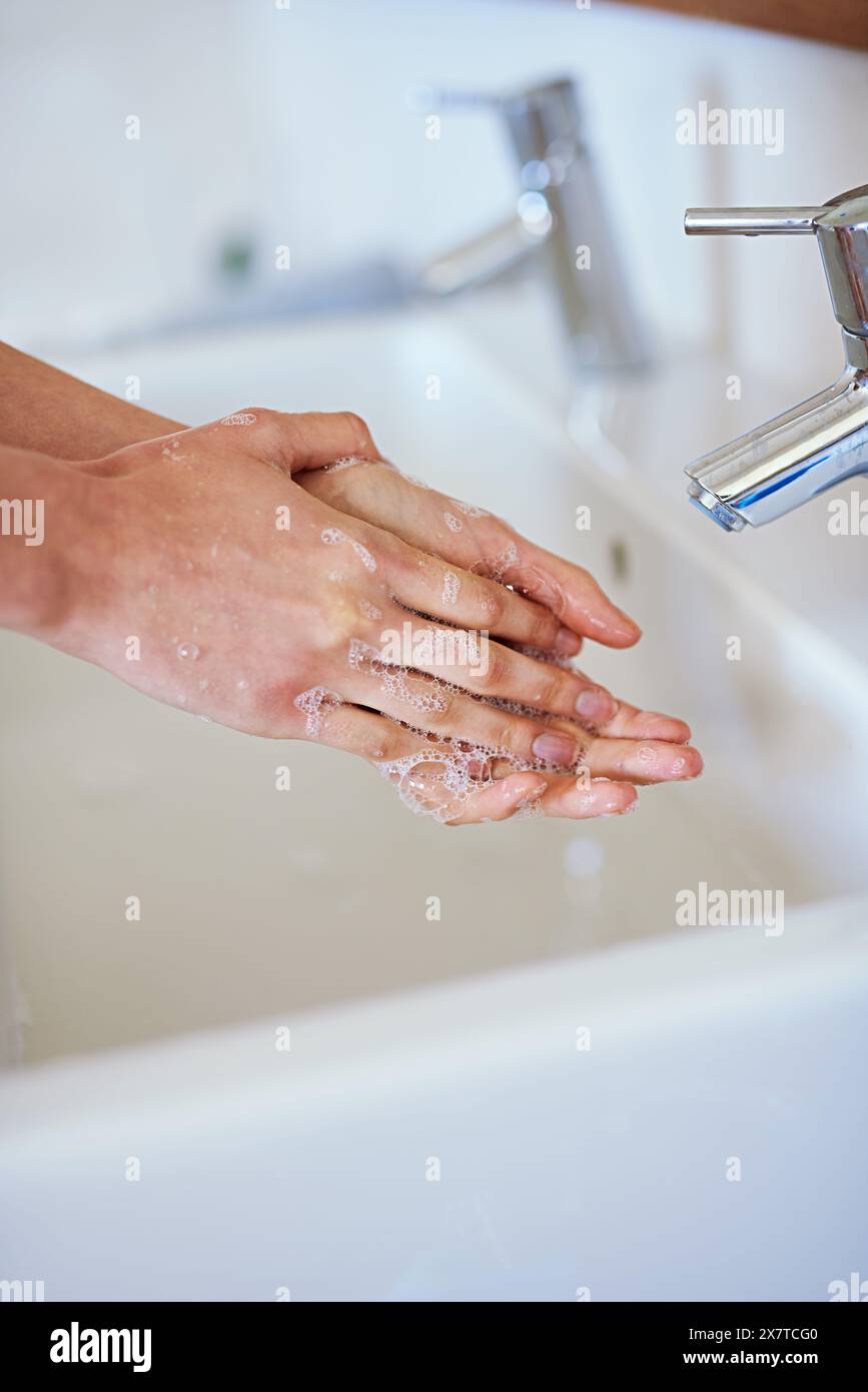 Woman, hands and soap for washing in bathroom with water, cleaning for ...
