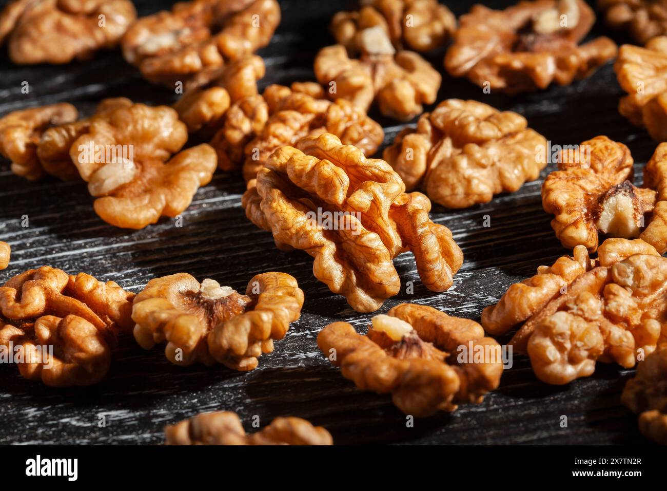 walnuts on black wood background Stock Photo
