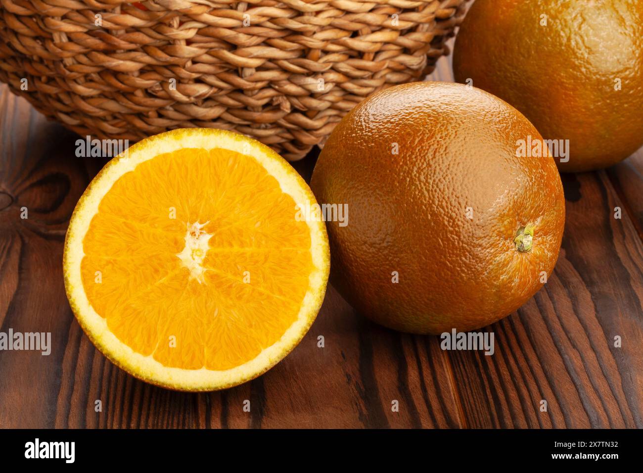 sliced chocolate oranges on wood background Stock Photo