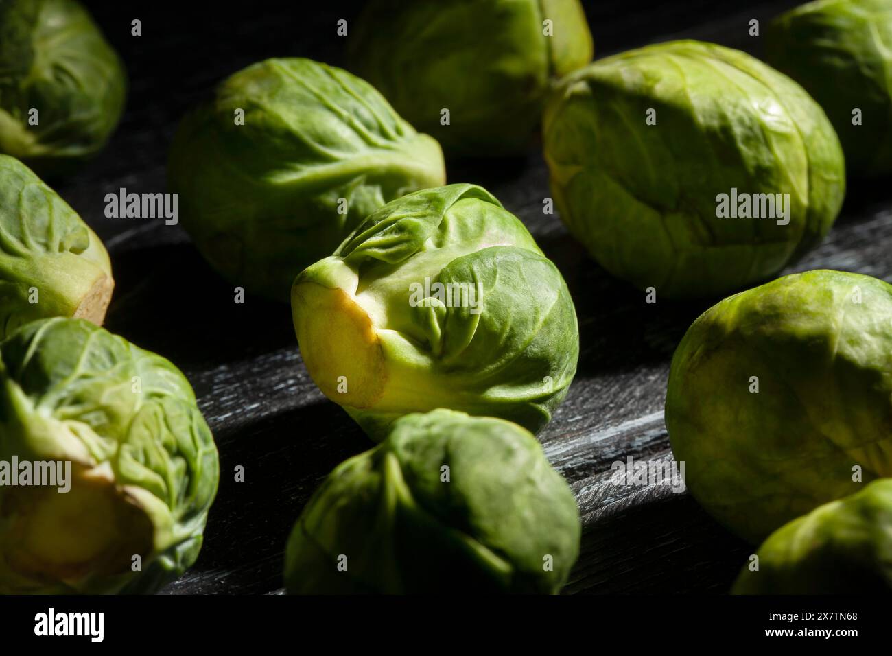 brussels sprouts on black wood background Stock Photo