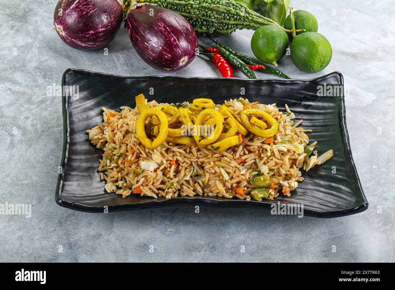 Asian cuisine - Fried rice with squid rings Stock Photo - Alamy