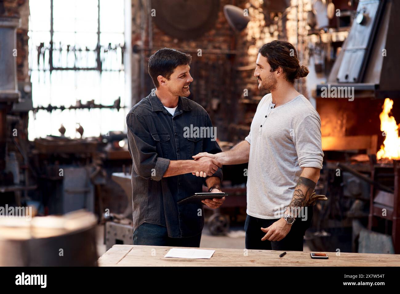 Fire Shake Hand Man shaking hands with man in fire hi-res stock photography and images ...