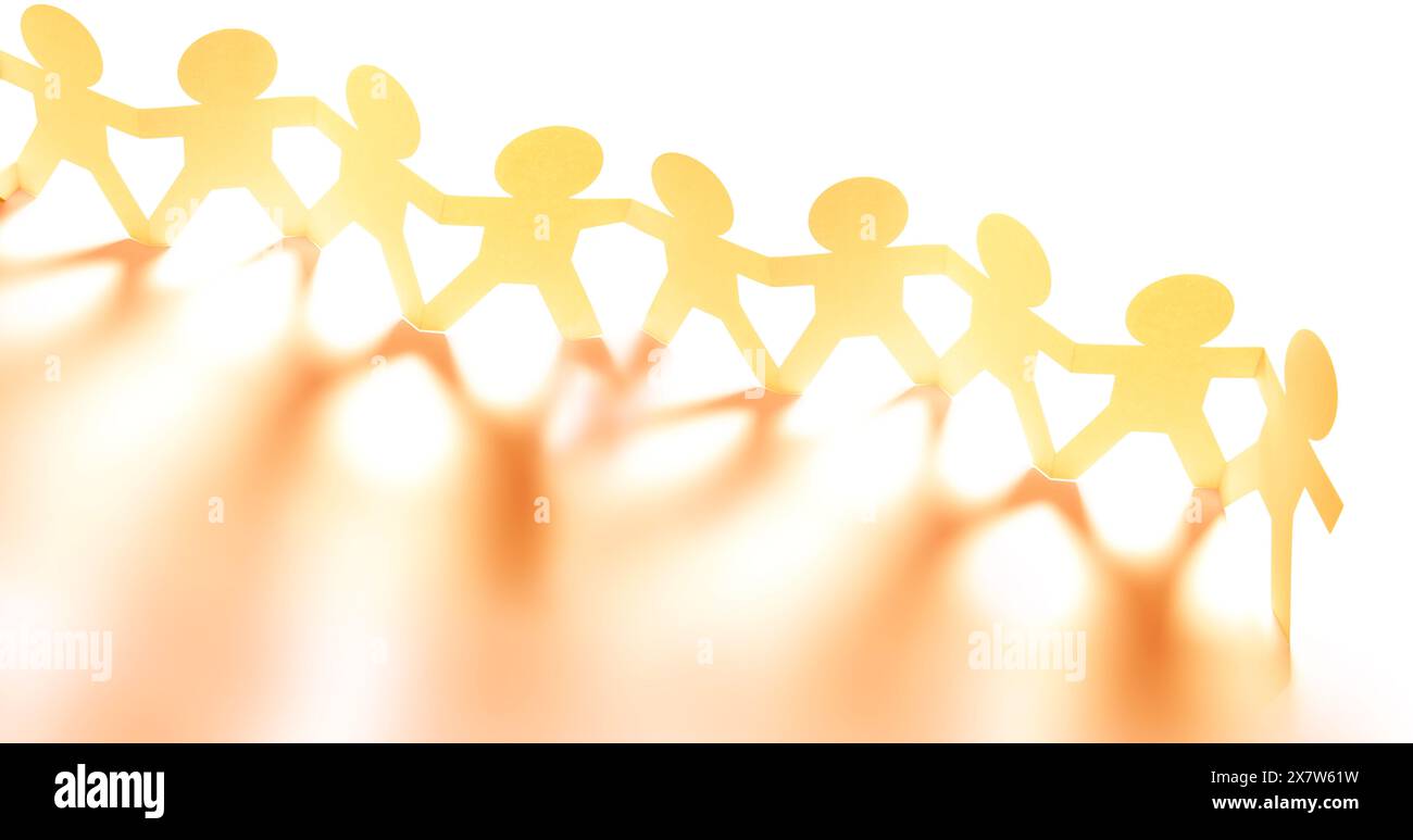 Team of paper chain people united together holding hands Stock Photo ...