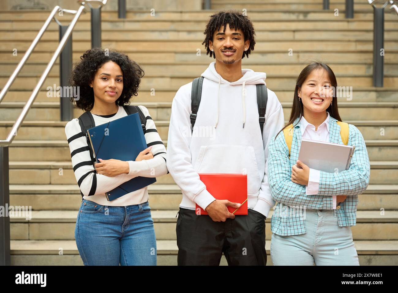 Three multiethnic students at the University Stock Photo