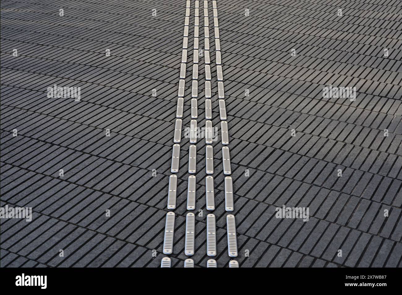 A close-up photo of a visually impaired person's guide block installed ...
