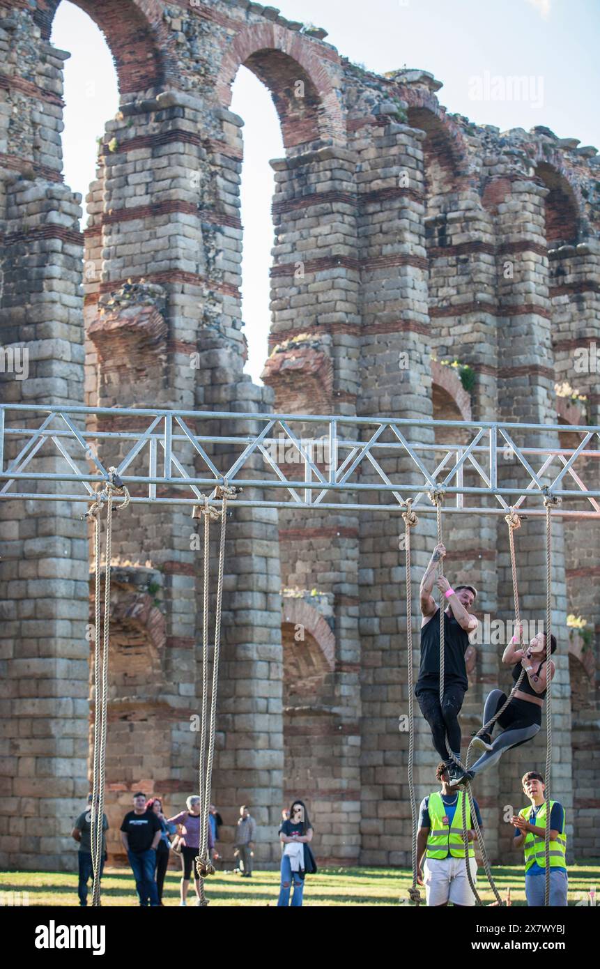 Merida, Spain - May 18th, 2024: FarinatoRace Merida 2024, Participants climbing a rope Stock Photo