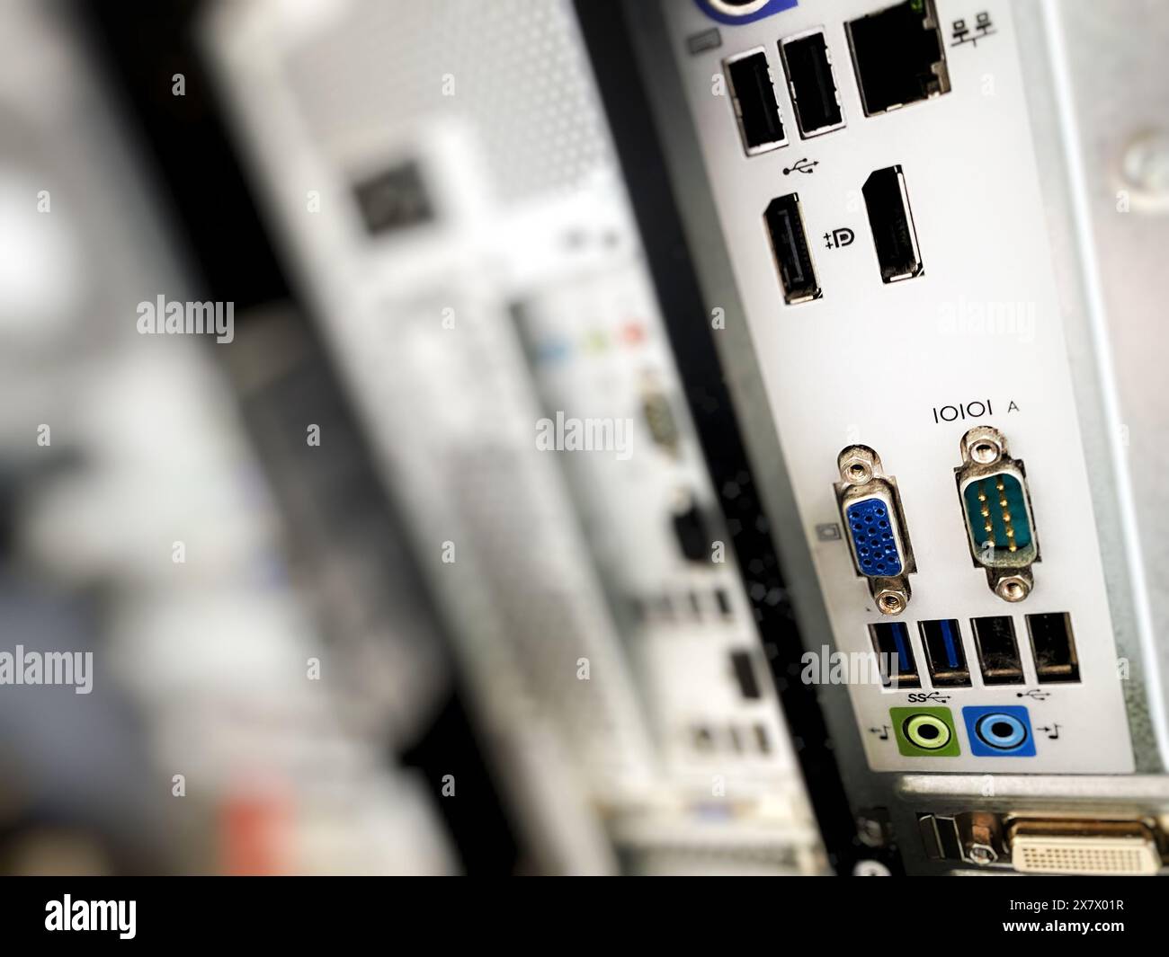 Closeup of USB ports, audio jacks, display ports, and other input-output port on the back of a desktop computer or workstation, connectivity concept Stock Photo