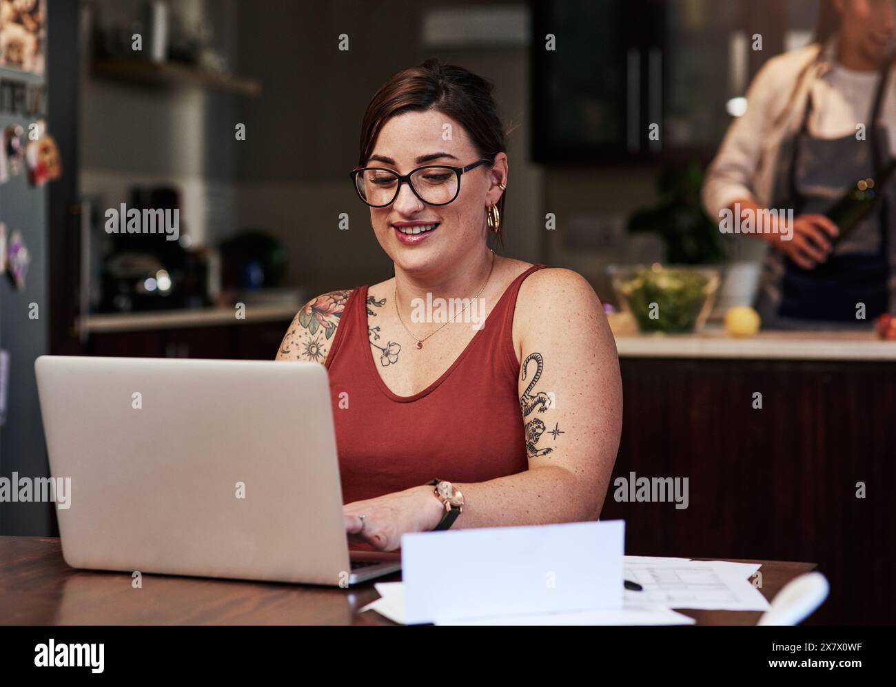 Woman, house and typing with bills by laptop for debt management, receipts and invoices for mortgage or rent payments. Girl, online and read or review Stock Photo