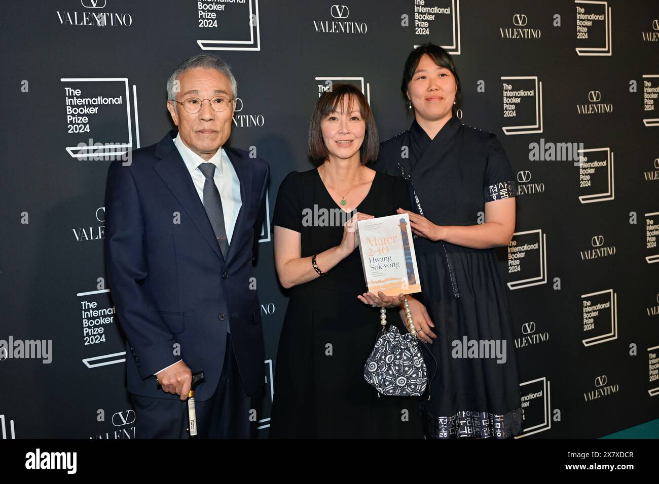 LONDON, ENGLAND - MAY 21 2024: Author Hwang Sok-yong, Translator Sora Kim-Russell and Translator Youngjae Josephine Bae with the shortlisted book 'Mater 2-10' attends The International Booker Prize 2024 announcement at Tate Modern in London, England. Credit: See Li/Picture Capital/Alamy Live News Stock Photo