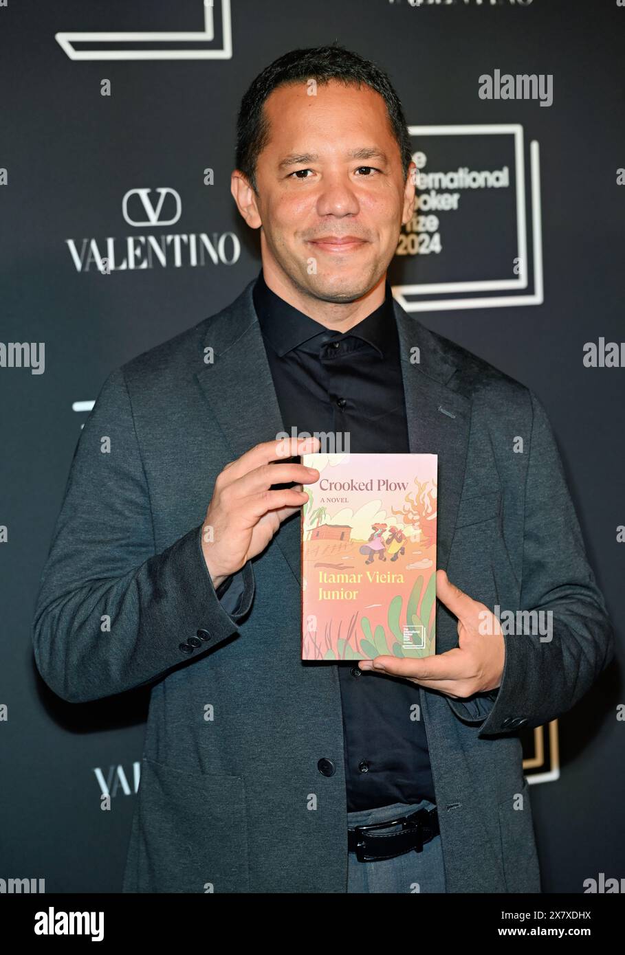 LONDON, ENGLAND - MAY 21 2024: Author Itamar Vieira Junior with the shortlisted book 'Crooked Plow' attends The International Booker Prize 2024 announcement at Tate Modern in London, England. Credit: See Li/Picture Capital/Alamy Live News Stock Photo