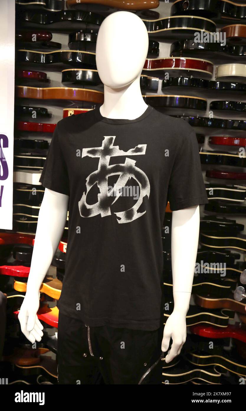 New York, New York, USA. 21st May, 2024. Japanese Hiragana symbol t-shirt, stage-worn by U2 bass guitarist, Adam Clayton, at the band's Las Vegas residency at the Sphere on October 25, 2023, estimate $800 - $1,200 seen during the ''˜Music Icons' Julien's Auctions press preview held at the Hard Rock Cafe. (Credit Image: © Nancy Kaszerman/ZUMA Press Wire) EDITORIAL USAGE ONLY! Not for Commercial USAGE! Stock Photo