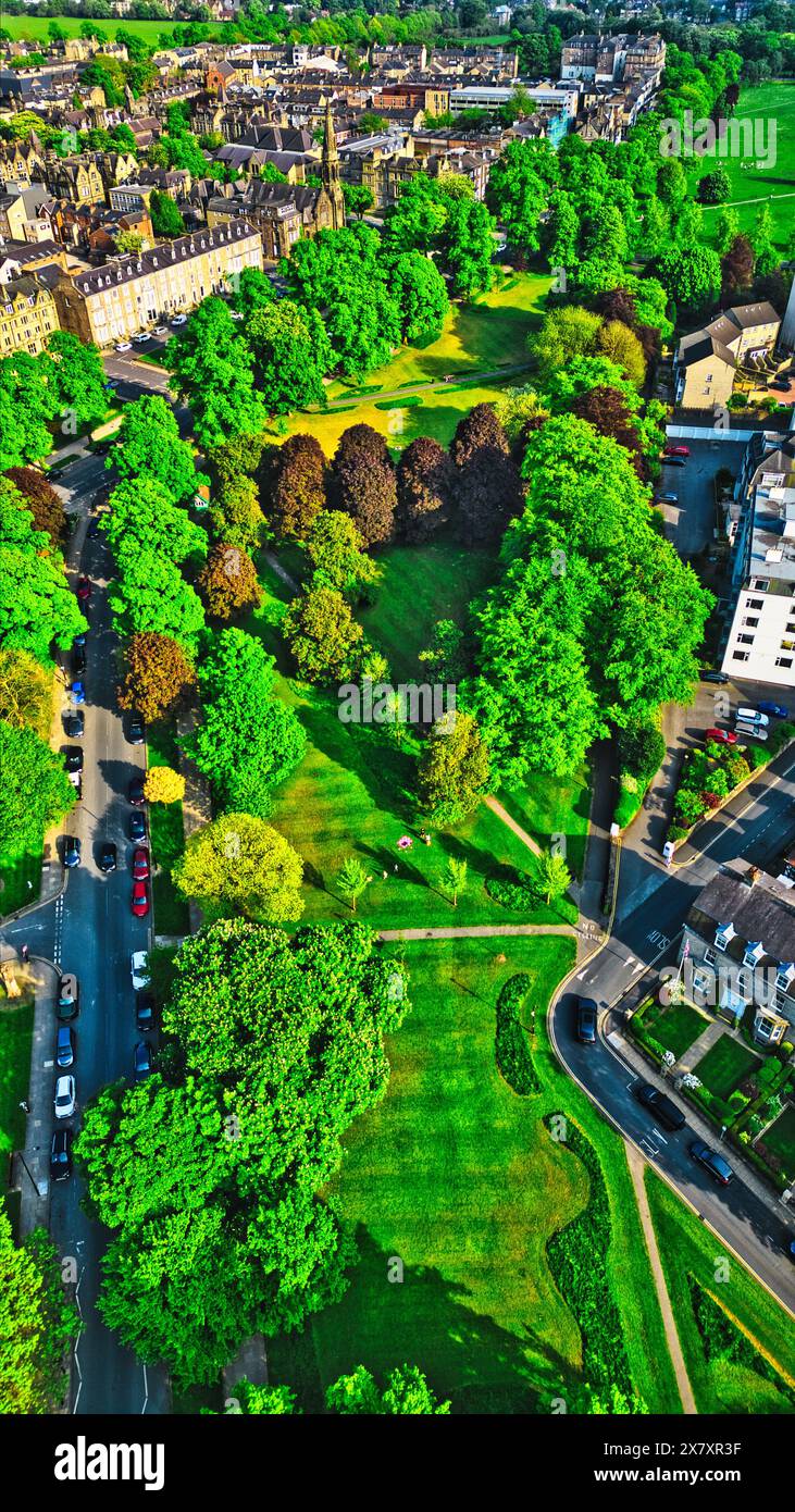 Aerial view of a lush green park surrounded by residential buildings ...