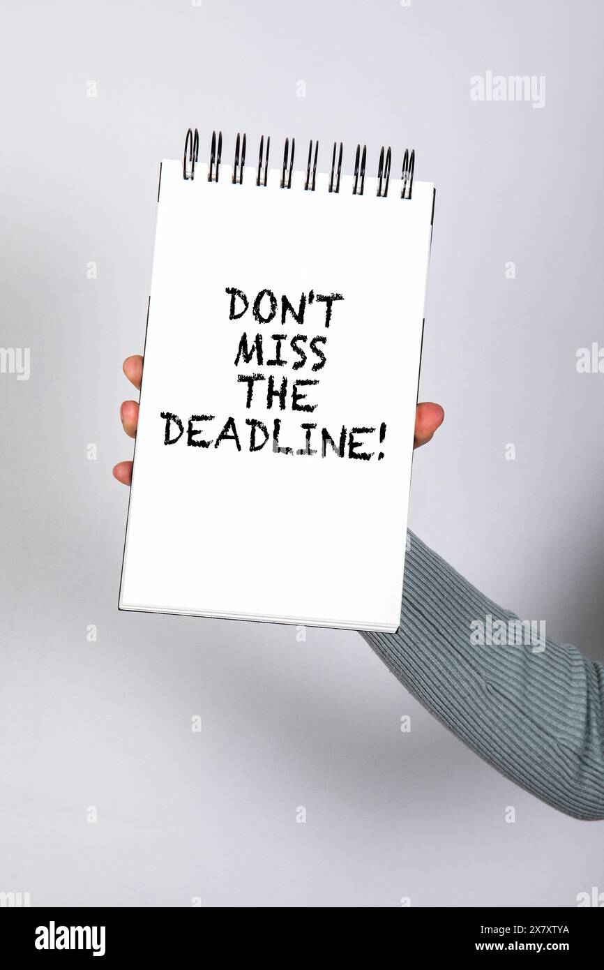 Don't miss the deadline. Notepad with text in woman's hand Stock Photo ...