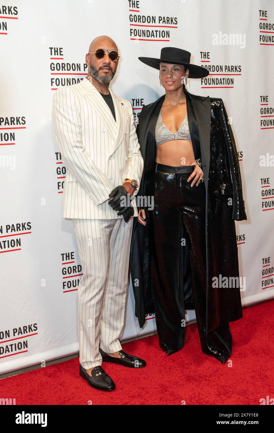 Swizz Beatz and Alicia Keys wearing dress by Dolce & Gabbana attend