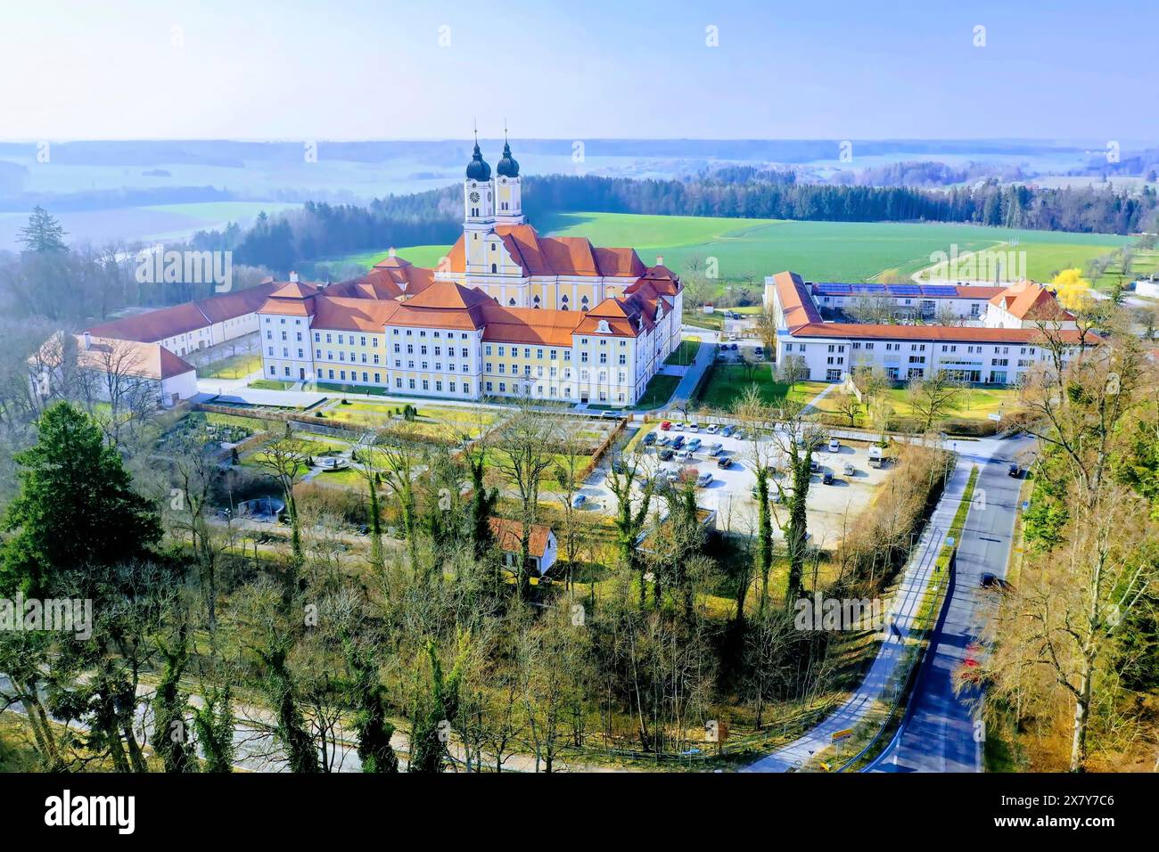 Aerial view of Roggenburg Abbey, a large baroque complex with a ...