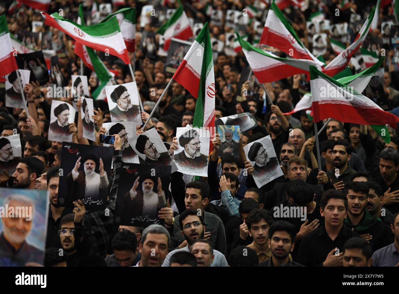 Beijing, Iran. 21st May, 2024. People attend a farewell ceremony held for Iran's late President Ebrahim Raisi, late Foreign Minister Hossein Amir-Abdollahian and others in Tehran, Iran, May 21, 2024. People in Tehran on Tuesday attended, in large numbers, a farewell ceremony held for Iran's late President Ebrahim Raisi, late Foreign Minister Hossein Amir-Abdollahian and others after their bodies were transferred from the northwestern city of Tabriz to the capital city. Credit: Shadati/Xinhua/Alamy Live News Stock Photo