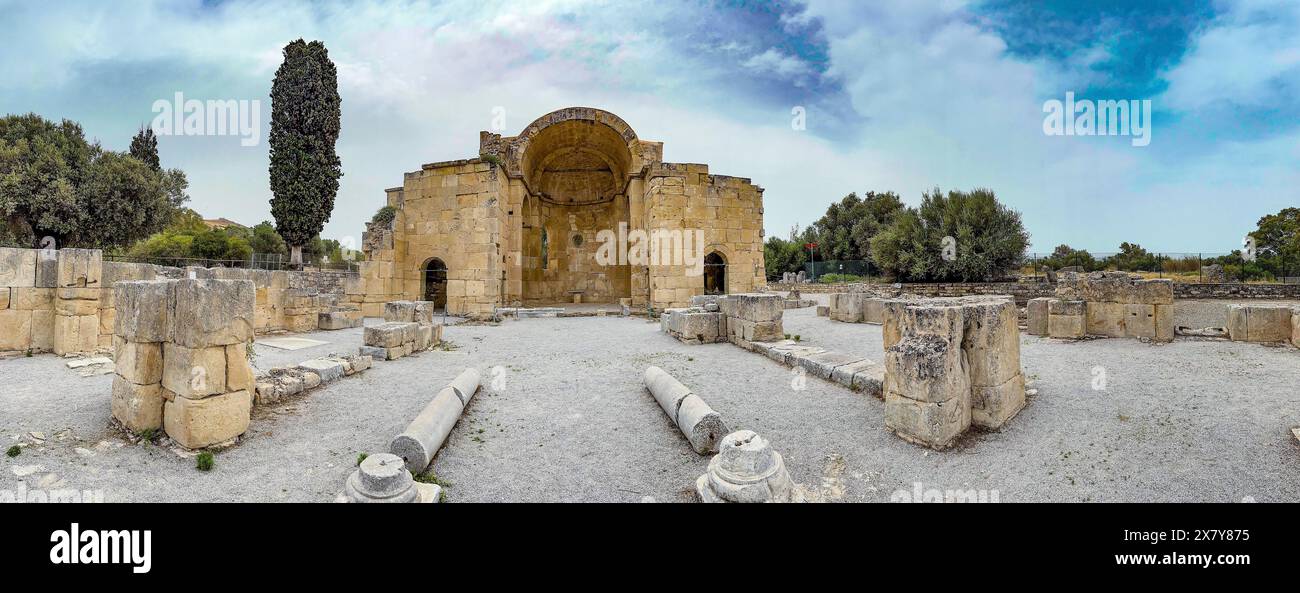 Panorama of view of ancient ruins of Titus Basilica, in the foreground remains of stones foundation walls of portal next to columns in the background Stock Photo