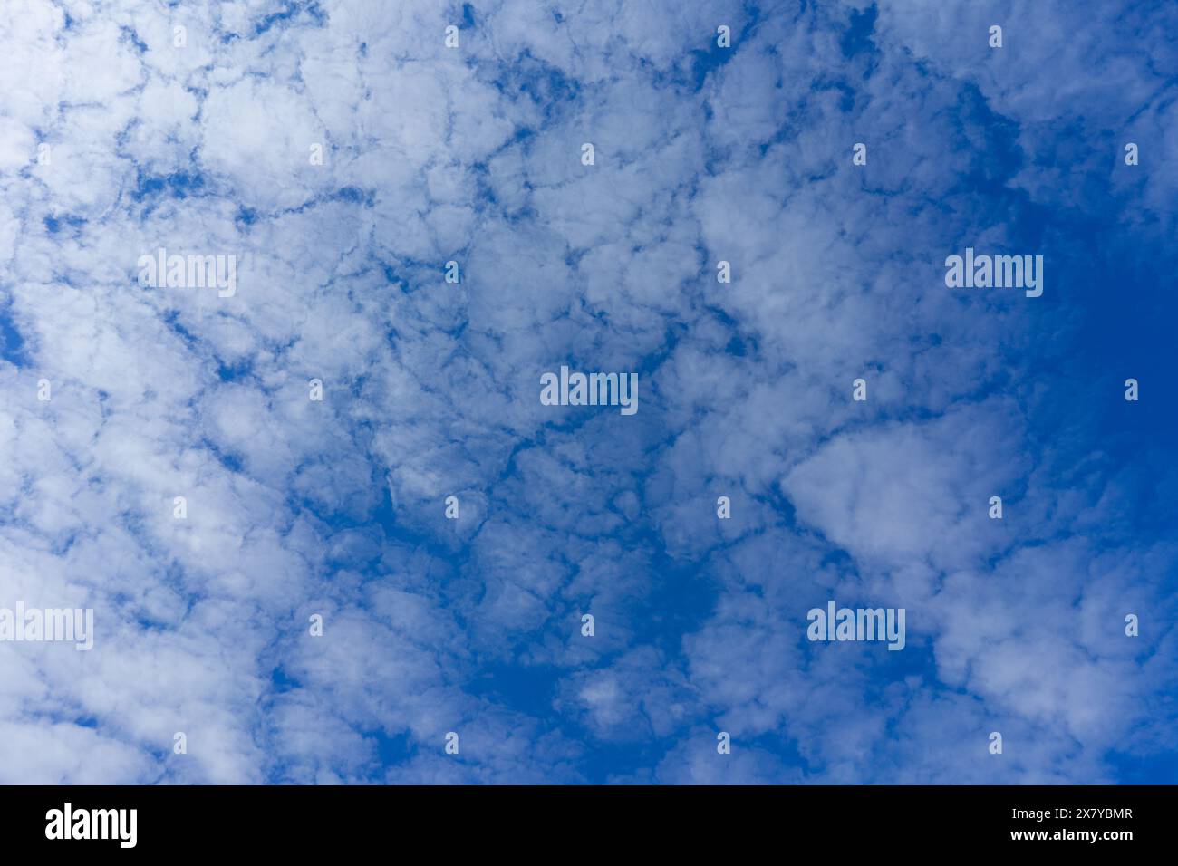 Blue sky with fluffy clouds, texture background Stock Photo