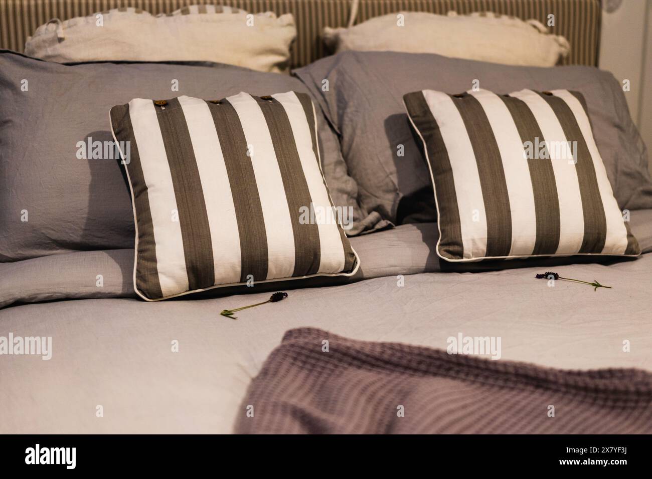 Comfortable hotel bed, classic style with set of pillows on bed, interior design concept Stock Photo