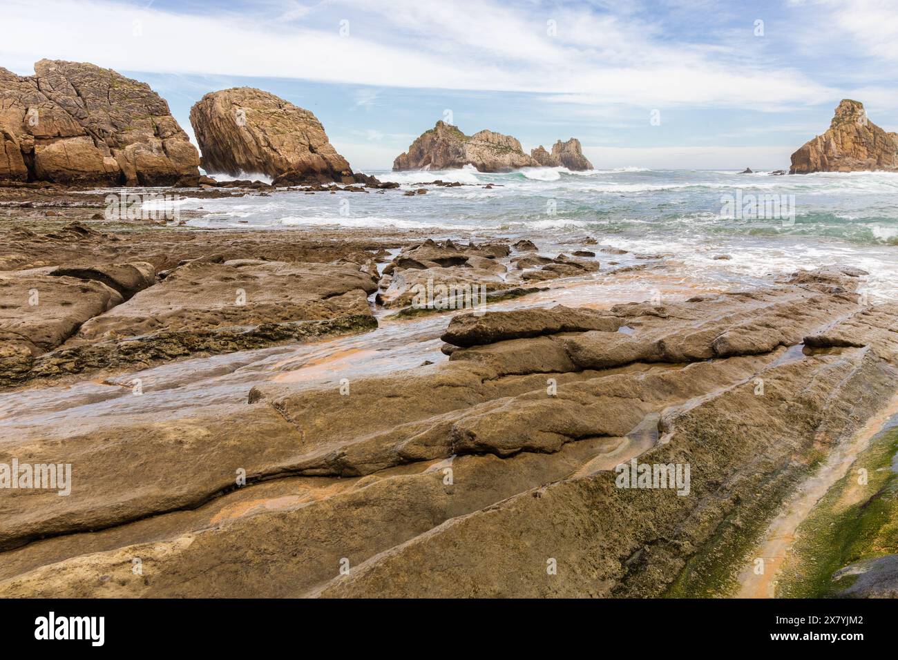 Coastal rocks eroded since the Glaciation, cliffs, and the stormy Atlantic Ocean. Costa Quebrada Geopark, Cantabria, Spain. Stock Photo