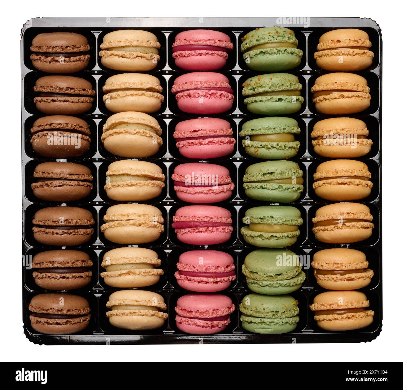 Multi-colored macarons in a plastic box, top view. Assortment. Isolated background Stock Photo