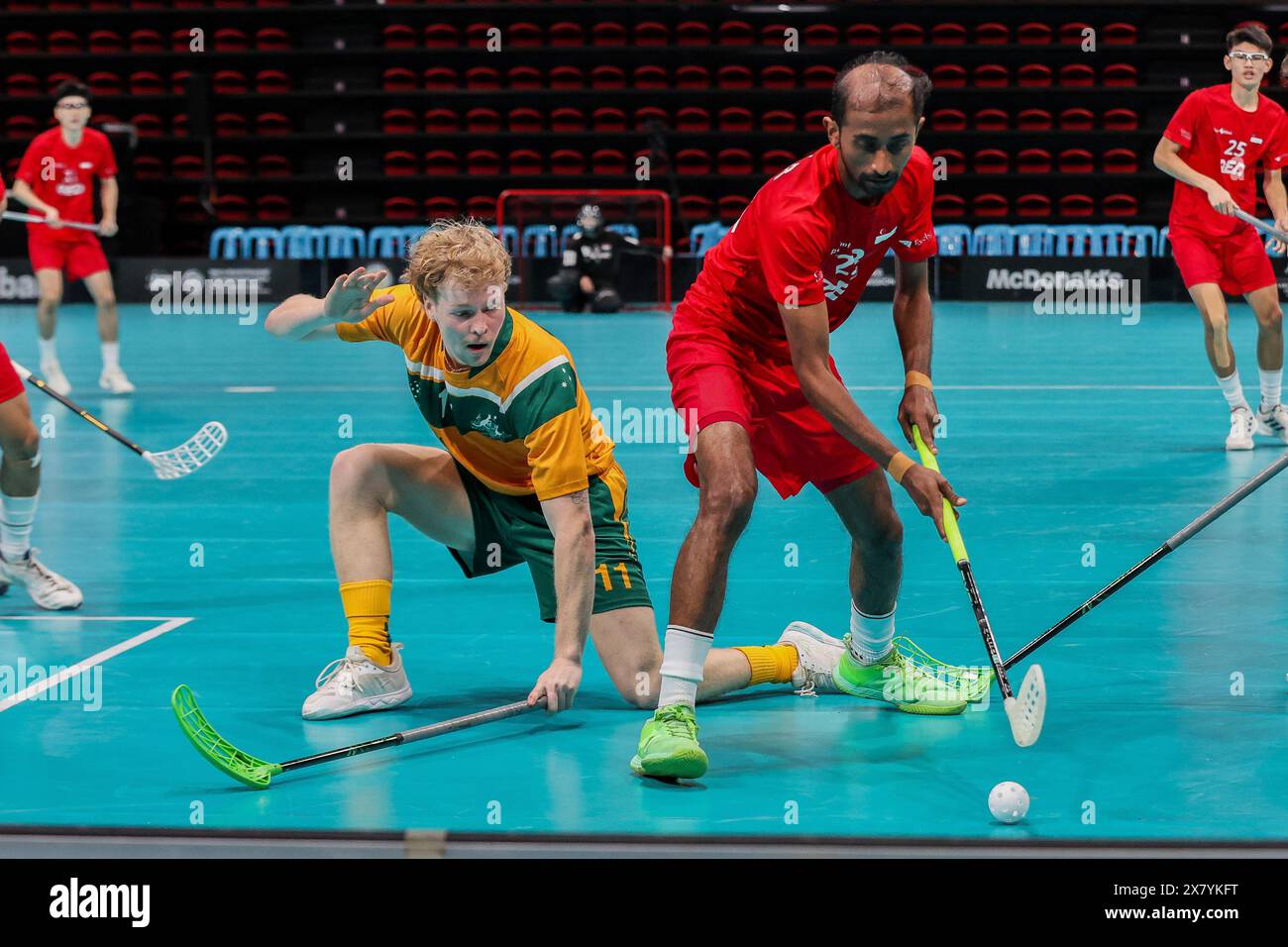 Pasig City, Philippines. 22nd May, 2024. Christian Newland (L) of Australia competes against Suria R of Singapore during the 2024 Men's World Floorball Championships qualifications between Australia and Singapore in Pasig City, the Philippines, on May 22, 2024. Credit: Rouelle Umali/Xinhua/Alamy Live News Stock Photo