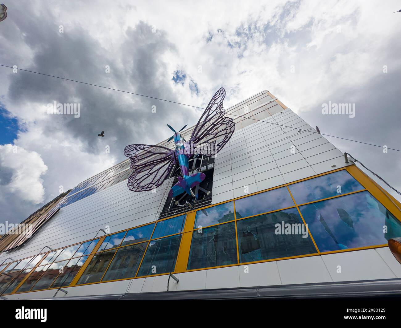 Installation of artworks on the facade of renovated Maj department store continues on May 20, 2024, Prague, Czech Republic. The author of two several- Stock Photo