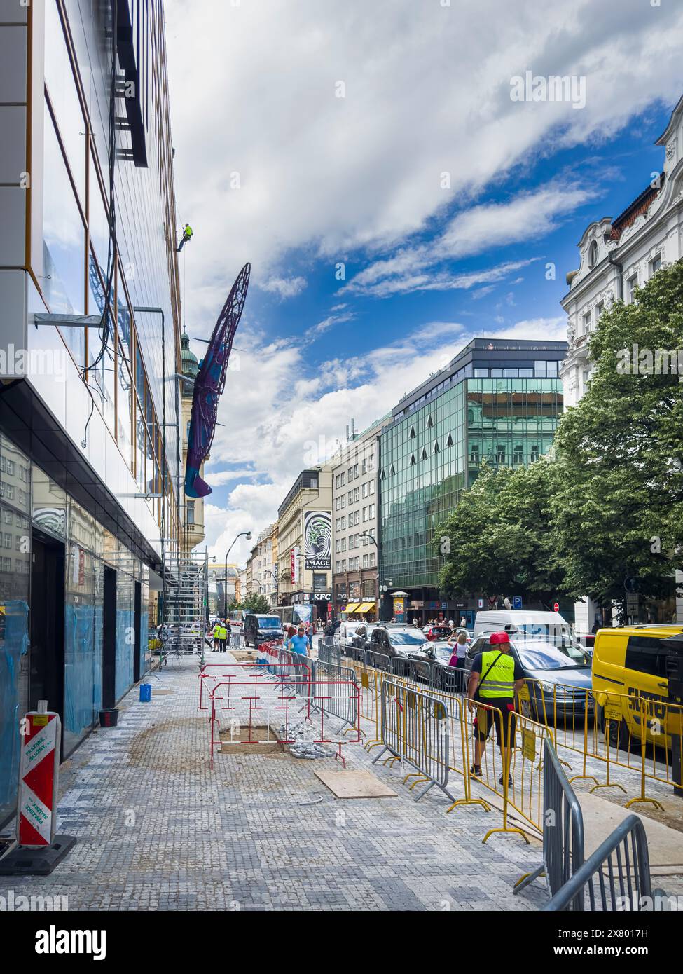 Installation of artworks on the facade of renovated Maj department store continues on May 20, 2024, Prague, Czech Republic. The author of two several- Stock Photo