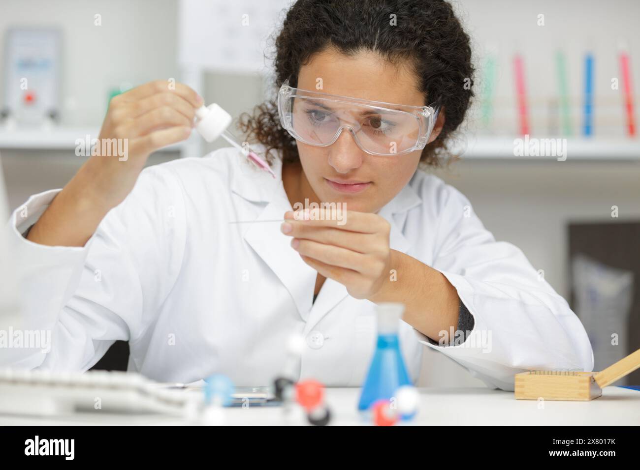 woman working with pipettes in a lab Stock Photo - Alamy