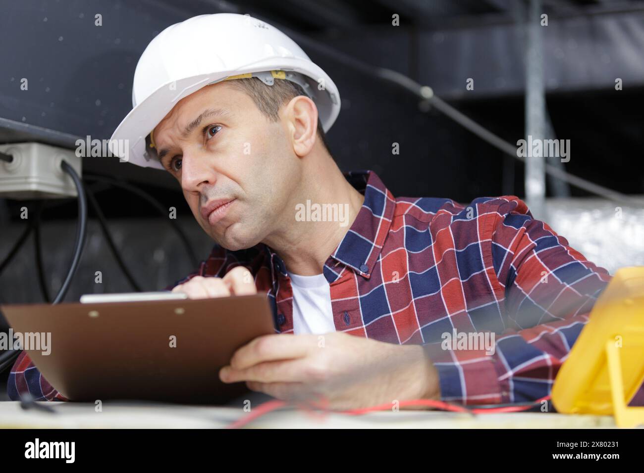 Young handsome builder holds hi-res stock photography and images - Alamy