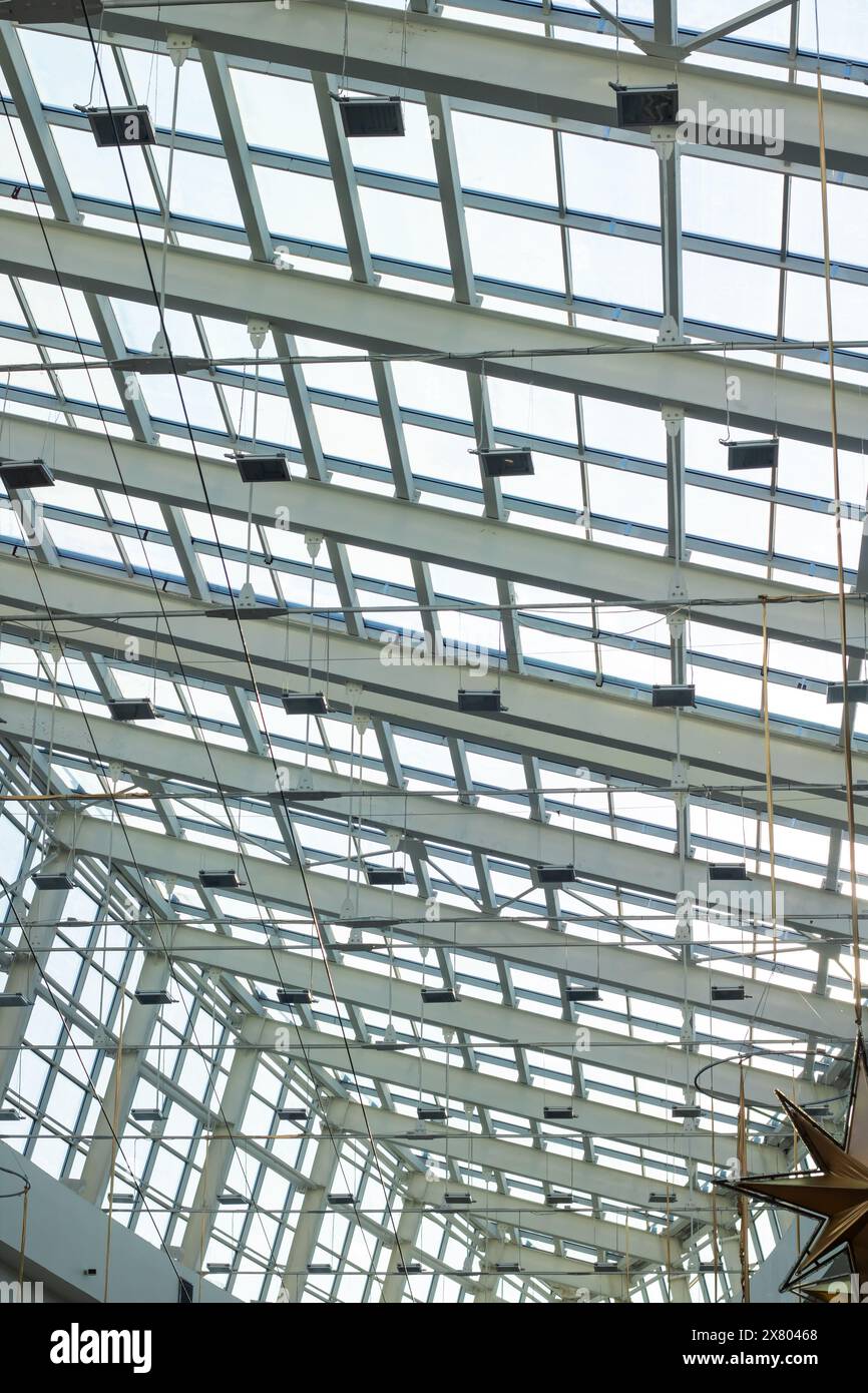 An urban design marvel, a starshaped light fixture hangs beautifully ...