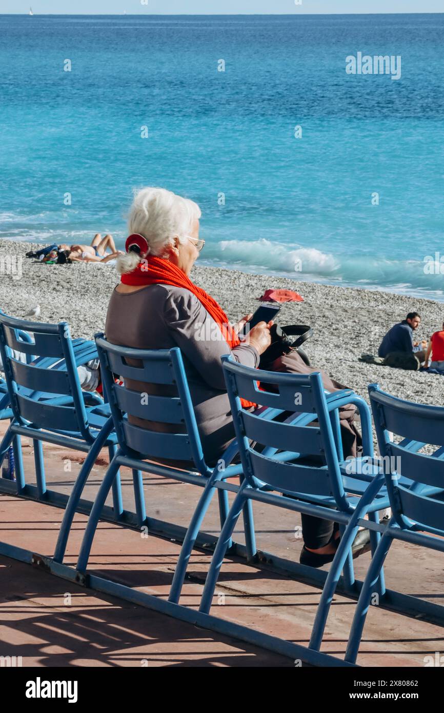 Old lady sitting in a chair hi-res stock photography and images - Alamy