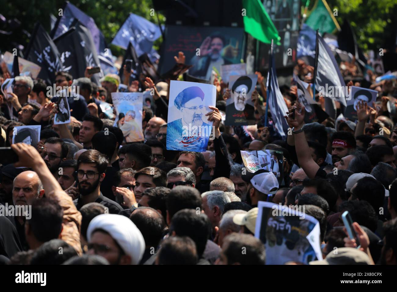 Tehran, Iran. Tehran, Iran. 22nd May, 2024. Iranian mourners hold up posters during a funeral ceremony for the late President Ebrahim Raisi and his companions who were killed during a helicopter crash in a mountainous region of the country's northwest, in Tehran. Credit: ZUMA Press, Inc./Alamy Live News Stock Photo
