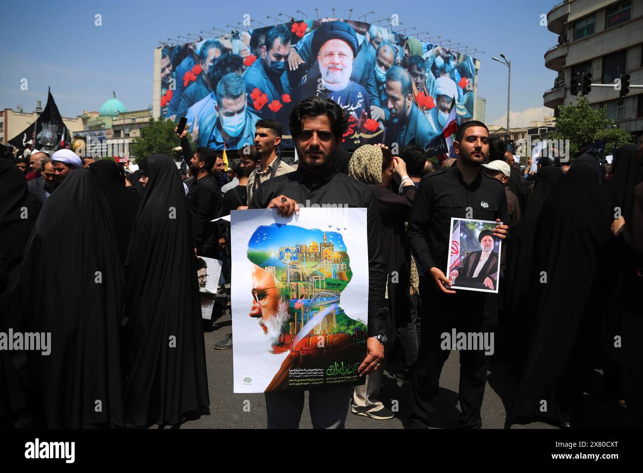 Tehran, Iran. Tehran, Iran. 22nd May, 2024. An Iranian man holds a poster during a funeral ceremony for the late President Ebrahim Raisi and his companions, who were killed during a helicopter crash in a mountainous region of the country's northwest in Tehran. Credit: ZUMA Press, Inc./Alamy Live News Stock Photo