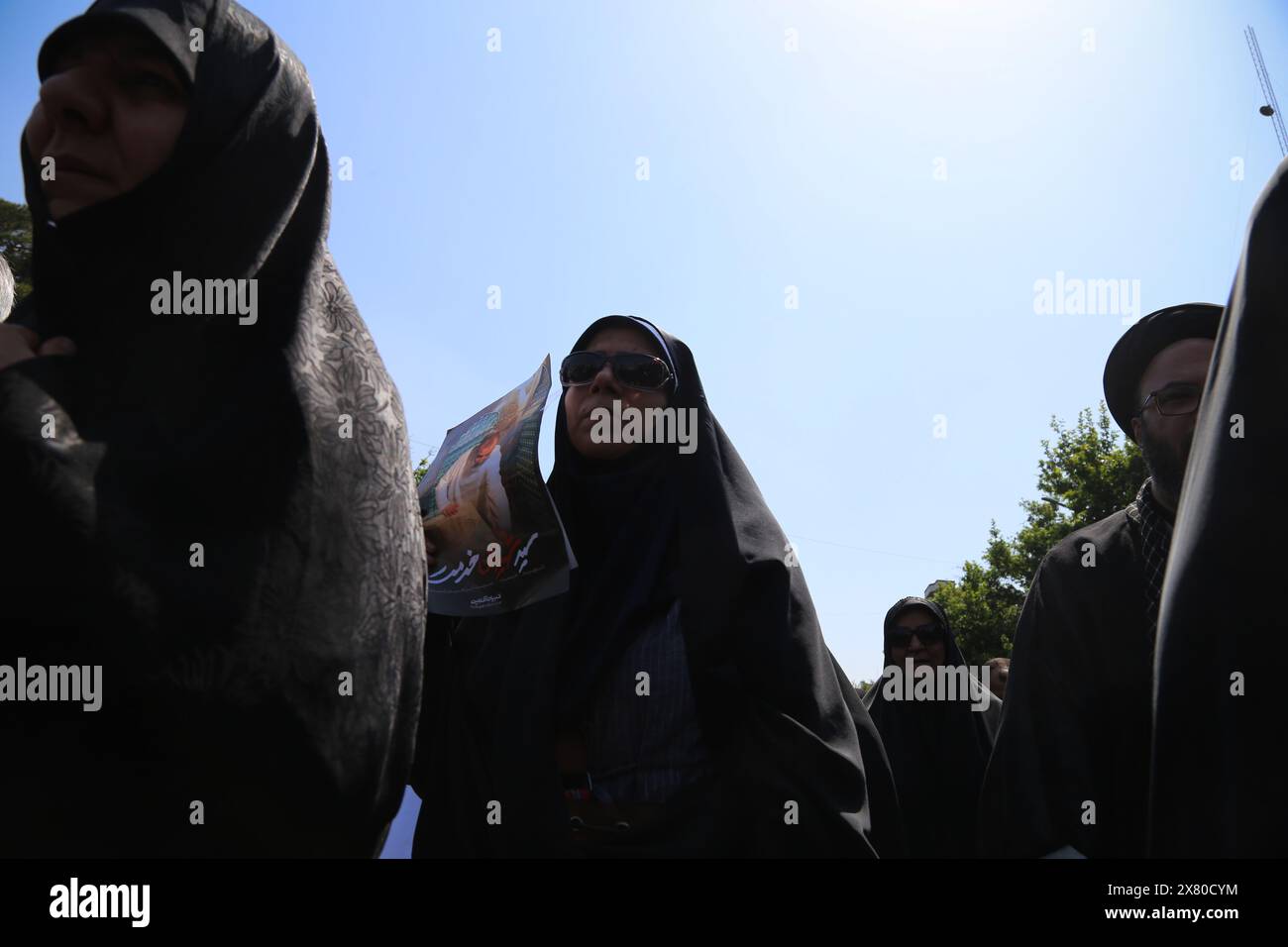 Tehran, Iran. May 22, 2024, Tehran, Iran: Iranian veiled women in black Chadors walk during a funeral ceremony for the late President Ebrahim Raisi and his companions who were killed during a helicopter crash in a mountainous region of the country's northwest, in Tehran. Credit: ZUMA Press, Inc./Alamy Live News Stock Photo