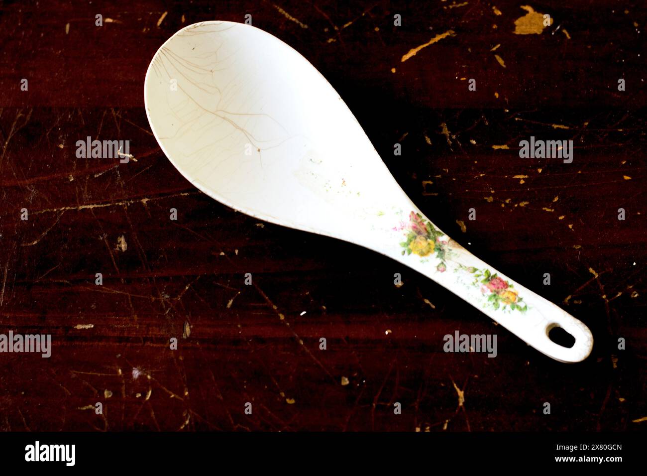 Plastic spoon on wood background Stock Photo