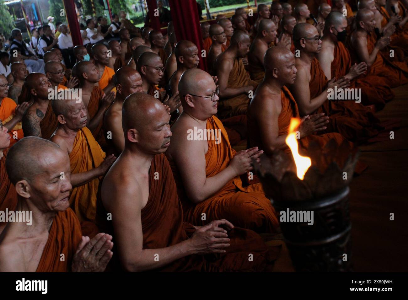 May 22, 2024, Magelang, Central Java, Indonesia: Buddhist monks take part in the procession of the ritual of sanctifying blessed water, as part of the celebration of the Tri Sacred Vesak celebration at Mendut Temple. (Credit Image: © Angga Budhiyanto/ZUMA Press Wire) EDITORIAL USAGE ONLY! Not for Commercial USAGE! Stock Photo