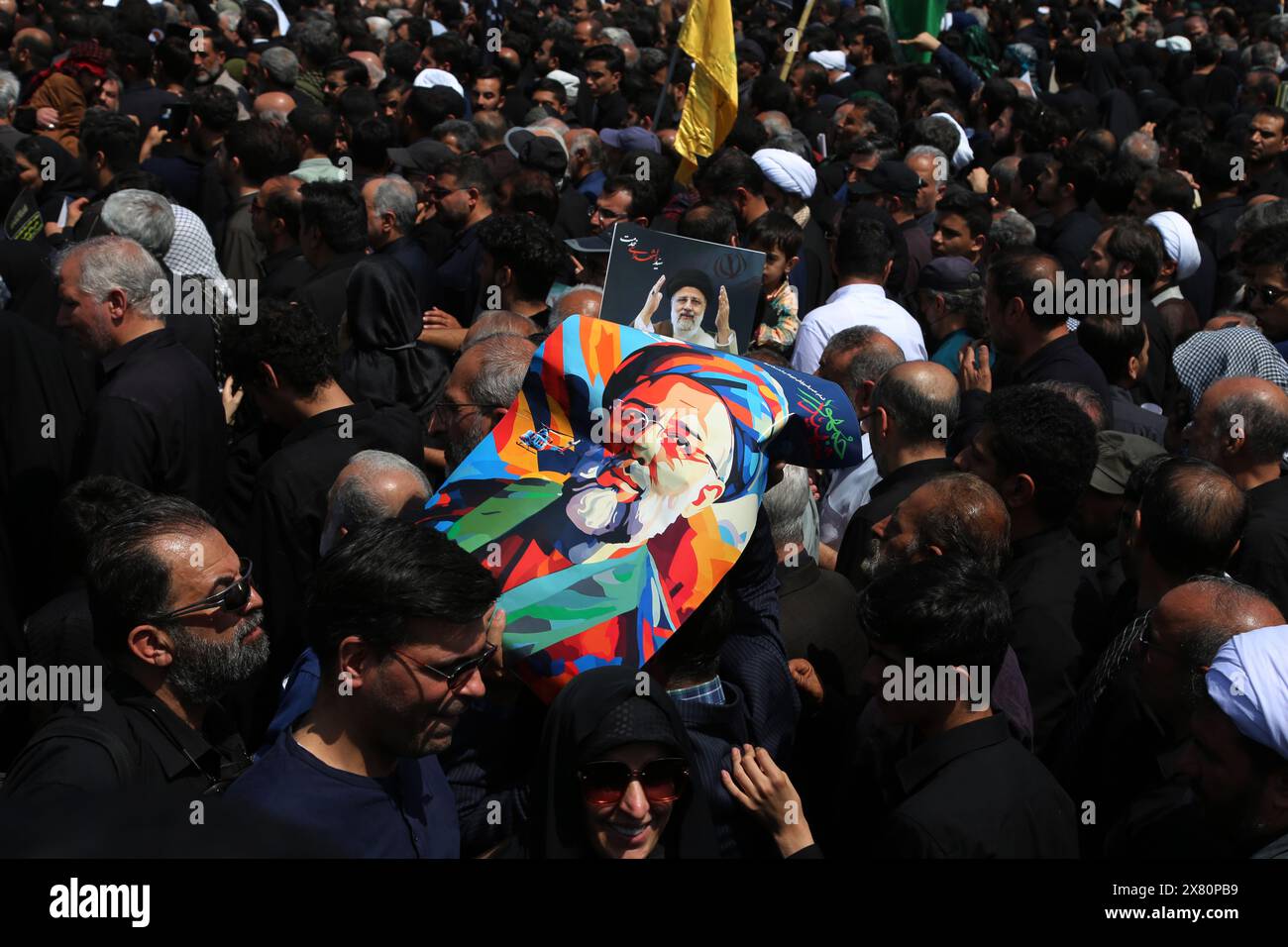 Tehran, Iran. 22nd May, 2024. Iranians attend a funeral ceremony for the late President Ebrahim Raisi and his companions who were killed during a helicopter crash on Sunday in a mountainous region of the country's northwest, in Tehran. Iran's supreme leader presided over the funeral Wednesday for the country's late president, foreign minister, and others killed in the helicopter crash, as tens of thousands later followed a procession of their caskets through the capital, Tehran. (Credit Image: © Rouzbeh Fouladi/ZUMA Press Wire) EDITORIAL USAGE ONLY! Not for Commercial USAGE! Stock Photo
