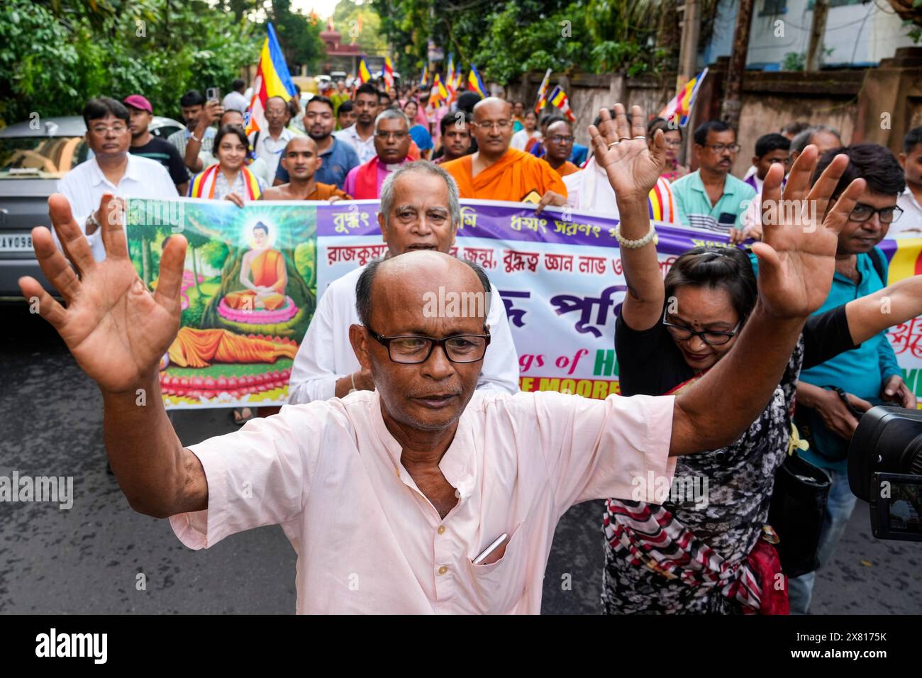Buddhist devotees sing religious songs as they participate in a peace ...