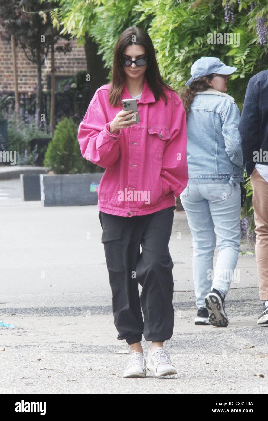 Emily Ratajkowski on her phone while out in the city. Featuring: Emily ...