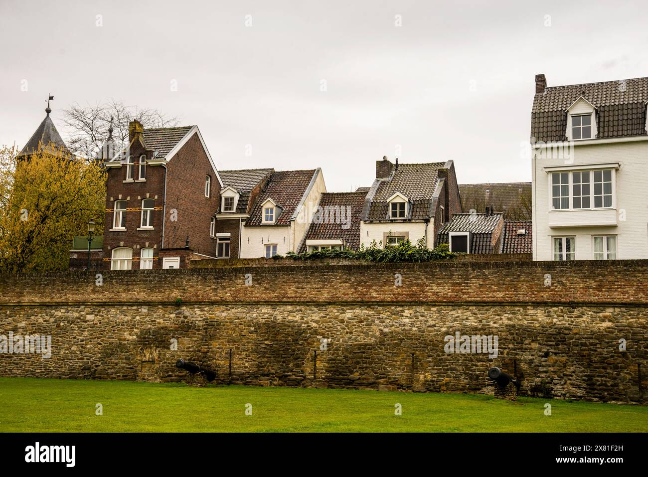 Medieval city wall and Dutch gable with recessed windows, Maastricht, Netherlands. Stock Photo