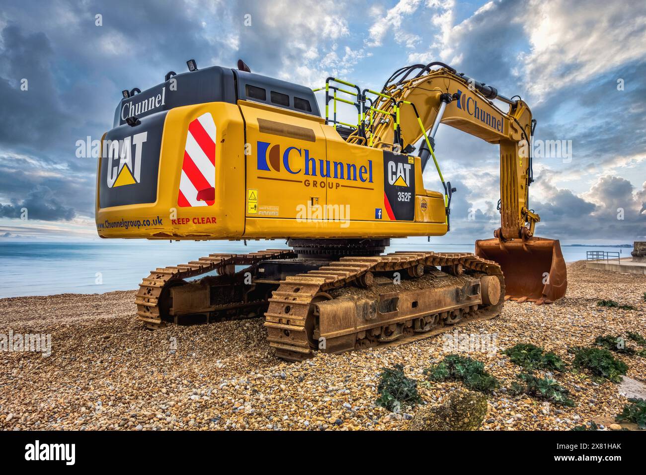 CAT 325F Hydraulic Excavator on Sandgate beach repairing sea defences