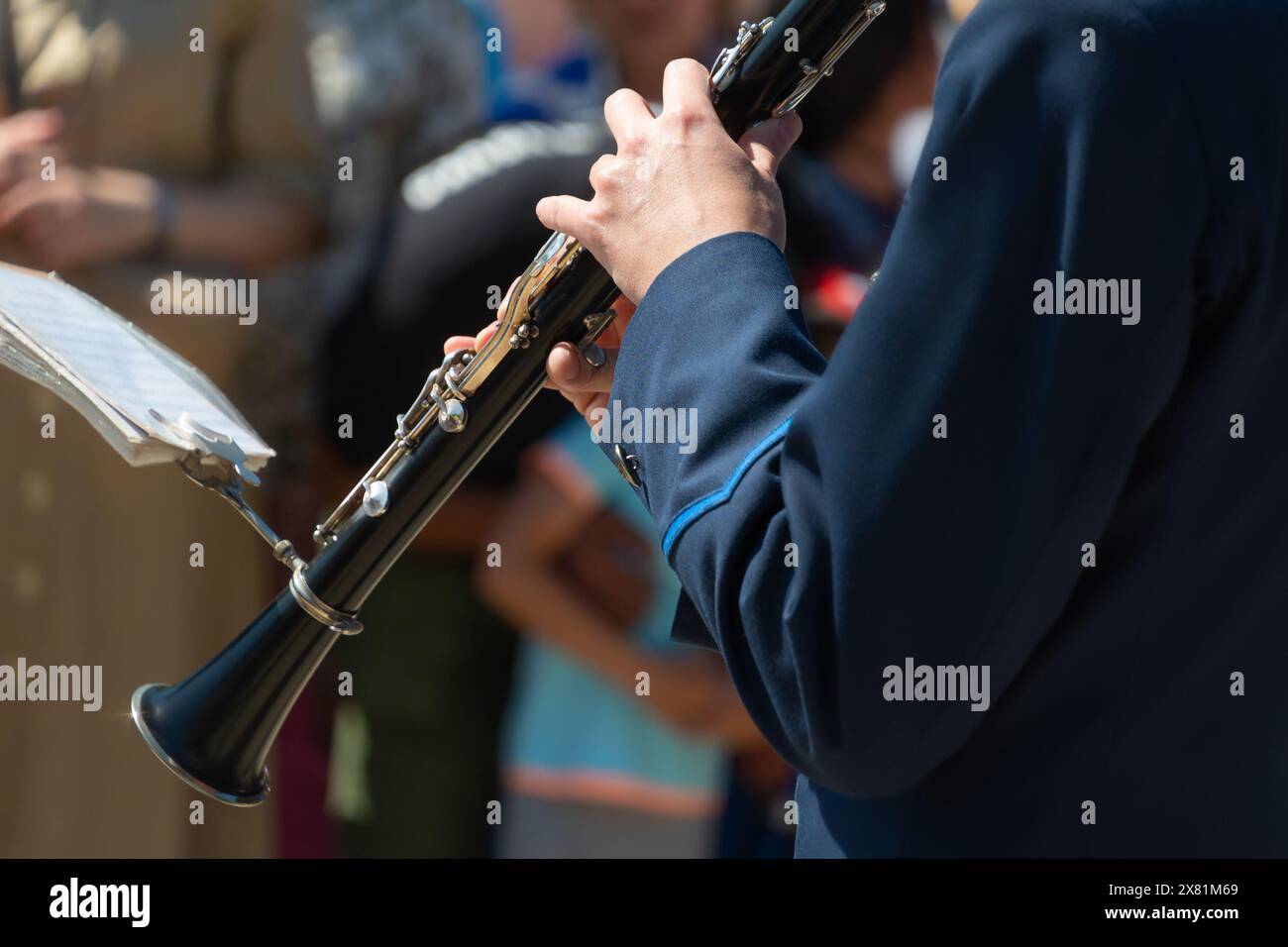A man plays the Performance by a musical orchestra Stock